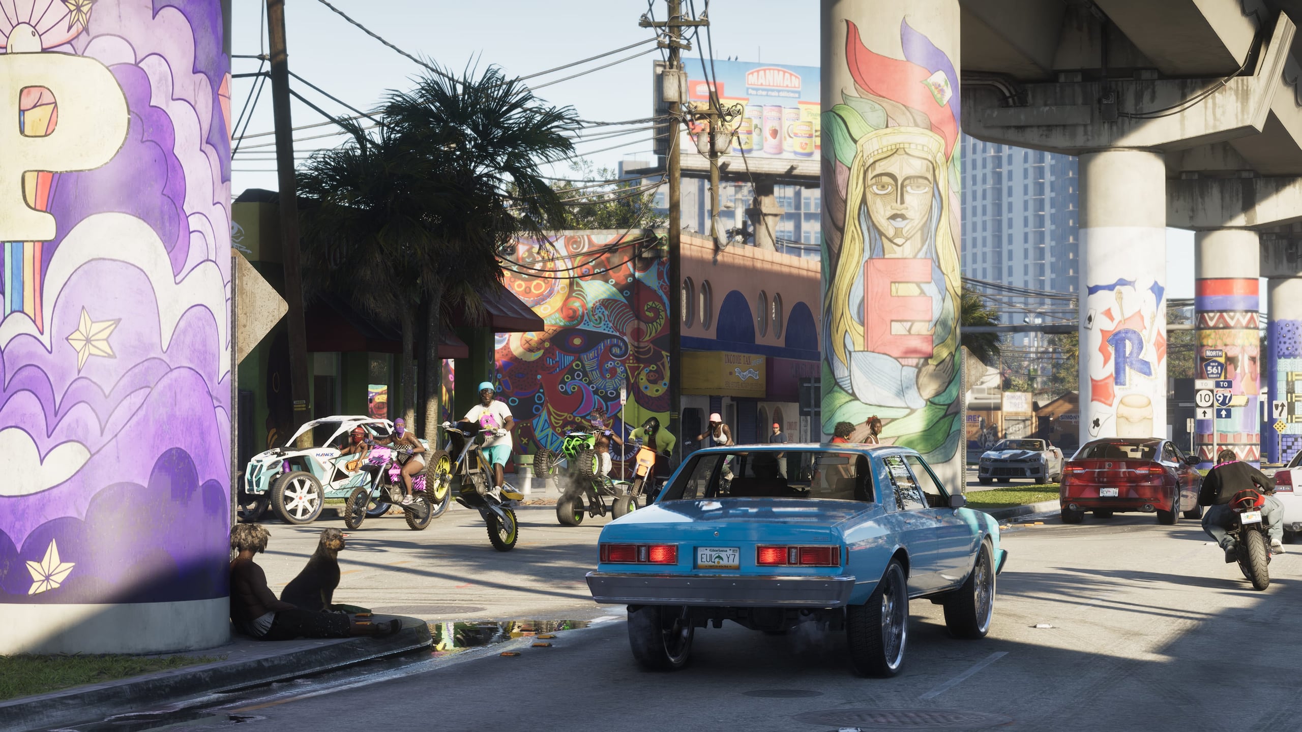 Straßenszene in Vice City unter der Hochstraße, mit Wandbildern und Palmen